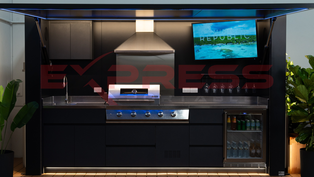 Modern outdoor kitchen with grill, sink, and TV screen displaying 'Republic Express'. Outdoor BBQ POD