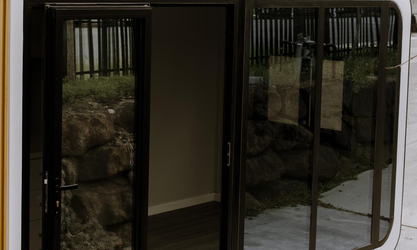 Floor-to-ceiling double-glazed glass walls to front and rear AS/NZS