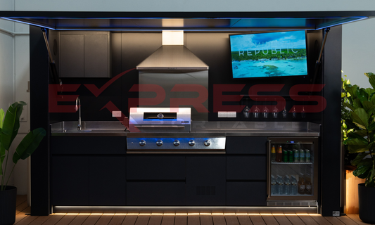 Modern outdoor kitchen with grill, sink, and TV screen displaying 'Republic Express'. Outdoor BBQ POD